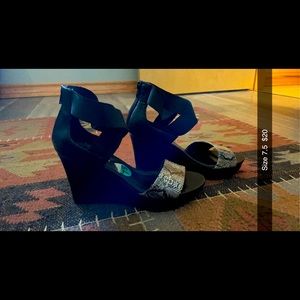 Black and snake print wedges